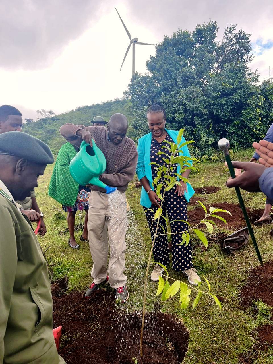 Secretary Administration, Mr. Abednego Etyang’, waters a newly planted tree during the State Department’s tree growing exercise at Ngong Hills.
